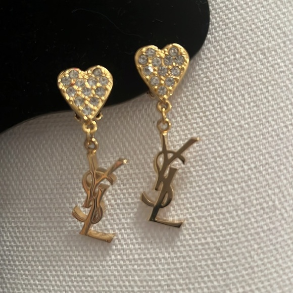 YSL Gold Heart Earrings The heart is full of rhinestones and then you have YSL.